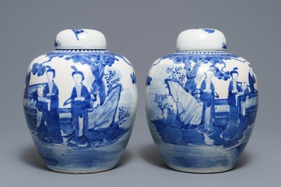 A pair of Chinese blue and white jars and covers with figures in a garden, Kangxi mark, 19th C.