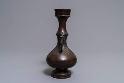 A Chinese bronze relief-decorated vase, Yuan/Ming