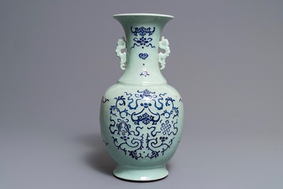 A Chinese blue and white on celadon ground 'buddhist emblems' vase, Qianlong mark and of the period