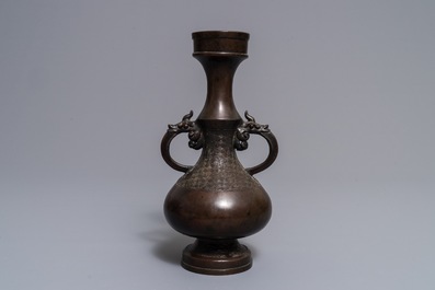 A Chinese bronze relief-decorated vase, Yuan/Ming