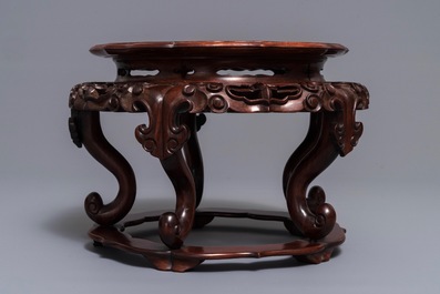 A Chinese rootwood-top carved wood stand, 19/20th C.