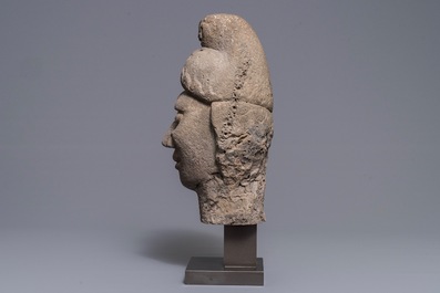 A Chinese carved stone head of a guardian, Ming