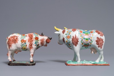 Two polychrome Dutch Delft petit feu cows on bases, 18th C.