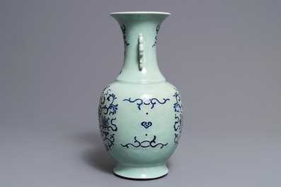 A Chinese blue and white on celadon ground 'buddhist emblems' vase, Qianlong mark and of the period