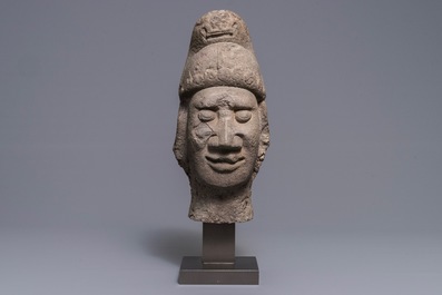 A Chinese carved stone head of a guardian, Ming