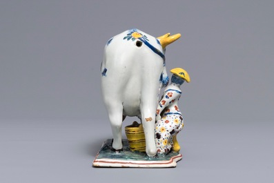 A large Dutch Delft polychrome cow milking group, 18th C.