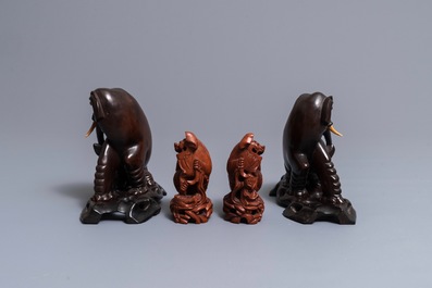 Two pairs of Chinese carved wood models of elephants and buddhist lions, Republic, 20th C.