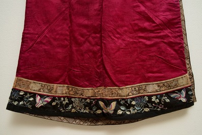 A Chinese informal Manchu embroidered silk pink-ground women's robe, 19th C.