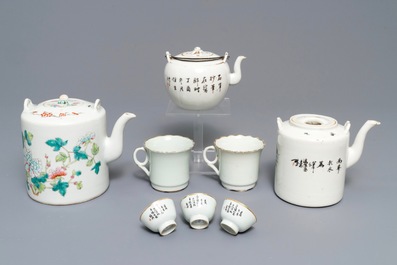 Three Chinese famille rose and qianjiang cai teapots and five cups, 19/20th C.