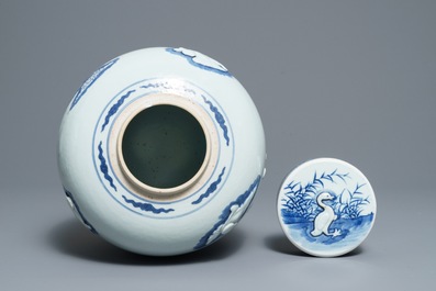 A Chinese blue and white jar and cover with applied design of ducks, Kangxi mark, 19th C.