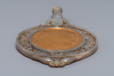 A Chinese Mughal-style carved grey jade hand mirror, 19/20th C.
