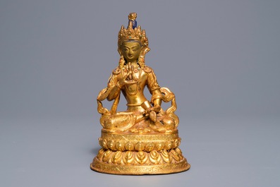 A Tibetan coral- and turquoise-inlaid gilt copper alloy figure of Tara, 19/20th C.