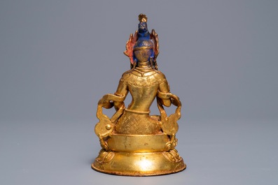 A Tibetan coral- and turquoise-inlaid gilt copper alloy figure of Tara, 19/20th C.