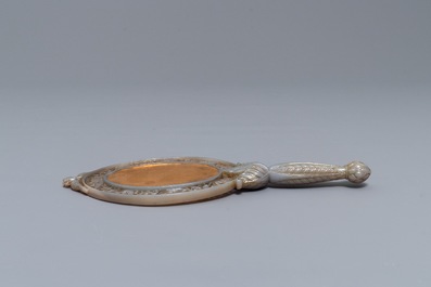 A Chinese Mughal-style carved grey jade hand mirror, 19/20th C.