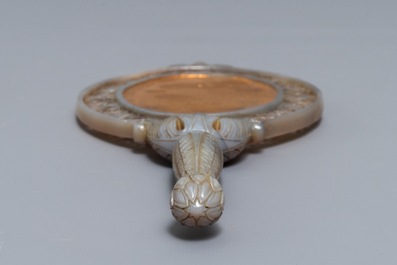 A Chinese Mughal-style carved grey jade hand mirror, 19/20th C.