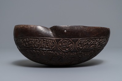 An islamic carved coco-de-mer 'kashkul' beggar's bowl, Qajar, Iran, 19th C.