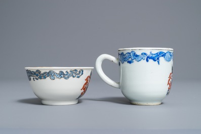 Two Chinese armorial cups and a saucer, Yongzheng