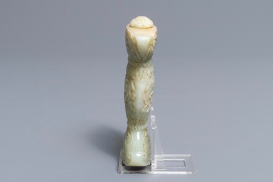 A Mughal-style carved celadon jade sword hilt, India, 19/20th C.