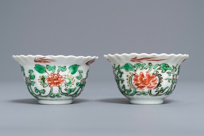 A pair of Chinese famille verte IHS-inscribed cups, Kangxi