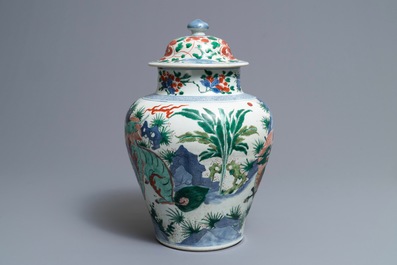 A Chinese wucai &lsquo;mythical beasts&rsquo; vase and cover, Transitional period