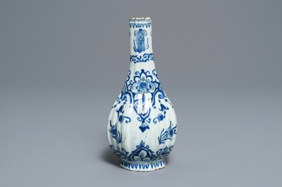 Two Dutch Delft blue and white chargers, an oval dish and a vase, 18th C.