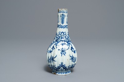 Two Dutch Delft blue and white chargers, an oval dish and a vase, 18th C.