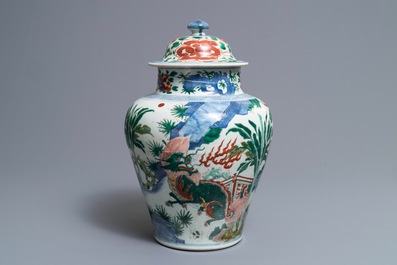 A Chinese wucai &lsquo;mythical beasts&rsquo; vase and cover, Transitional period