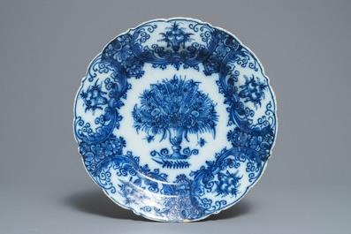 Two Dutch Delft blue and white chargers, an oval dish and a vase, 18th C.