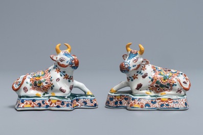 A pair of polychrome Dutch Delft models of recumbent cows, 18th C.