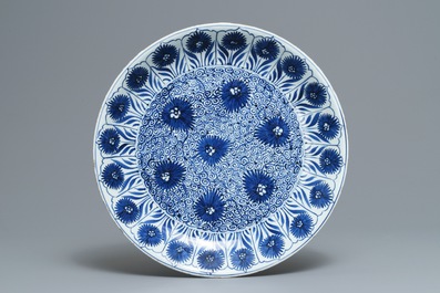 A Chinese blue and white 'aster' dish and a 'peony scroll' vase, Kangxi and 19th C.