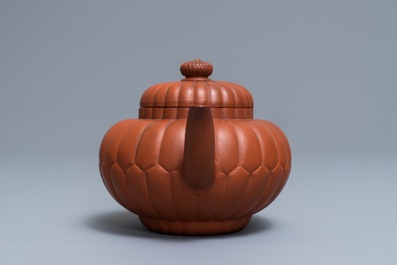 A Chinese Yixing stoneware 'chrysanthemum' teapot and cover, Kangxi