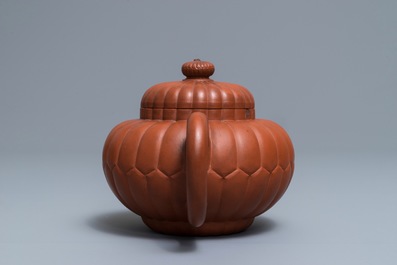 A Chinese Yixing stoneware 'chrysanthemum' teapot and cover, Kangxi