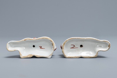 A pair of polychrome Dutch Delft models of recumbent cows, 18th C.