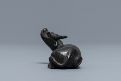 A Chinese bronze water dropper in the shape of a buffalo, two-character mark, Ming