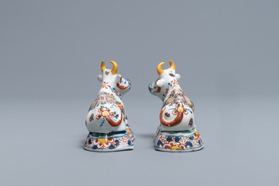 A pair of polychrome Dutch Delft models of recumbent cows, 18th C.