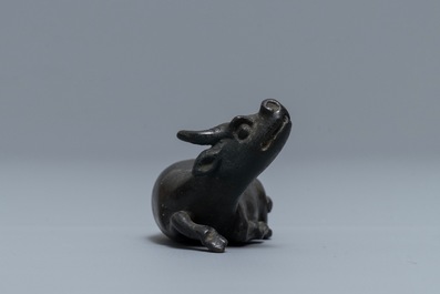 A Chinese bronze water dropper in the shape of a buffalo, two-character mark, Ming