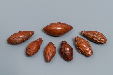 Seven Chinese carved olive pits, Republic, 20th C.