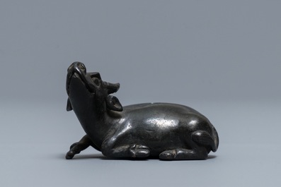 A Chinese bronze water dropper in the shape of a buffalo, two-character mark, Ming