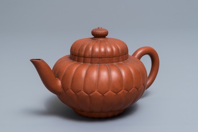 A Chinese Yixing stoneware 'chrysanthemum' teapot and cover, Kangxi