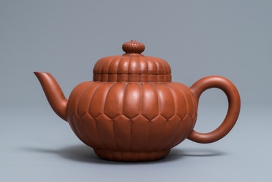 A Chinese Yixing stoneware 'chrysanthemum' teapot and cover, Kangxi