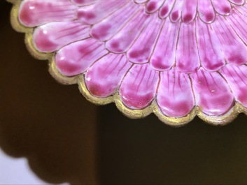 A Chinese famille rose lotus-shaped relief-decorated cup and saucer, Yongzheng