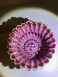 A Chinese famille rose lotus-shaped relief-decorated cup and saucer, Yongzheng