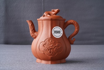 A Chinese Yixing stoneware wine jug with applied flowers and buffalo, Kangxi