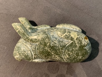 A Chinese jade deer rhyton cup and a spinach green jade pig, Han or later