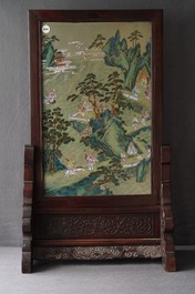 A large Chinese famille rose screen on hongmu stand, Qianlong