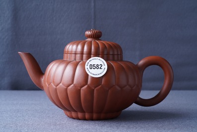 A Chinese Yixing stoneware 'chrysanthemum' teapot and cover, Kangxi
