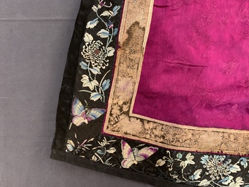 A Chinese informal Manchu embroidered silk pink-ground women's robe, 19th C.