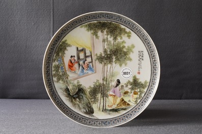 A Chinese fencai plate with figures in a garden, Republic, 20th C.