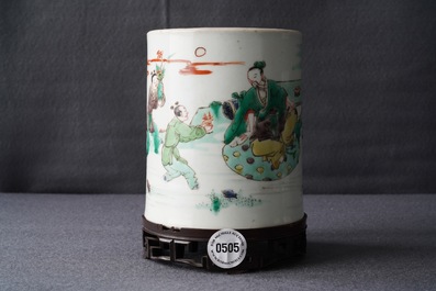 A Chinese famille verte brush pot on wooden stand, Kangxi