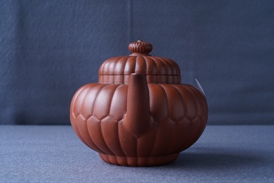 A Chinese Yixing stoneware 'chrysanthemum' teapot and cover, Kangxi